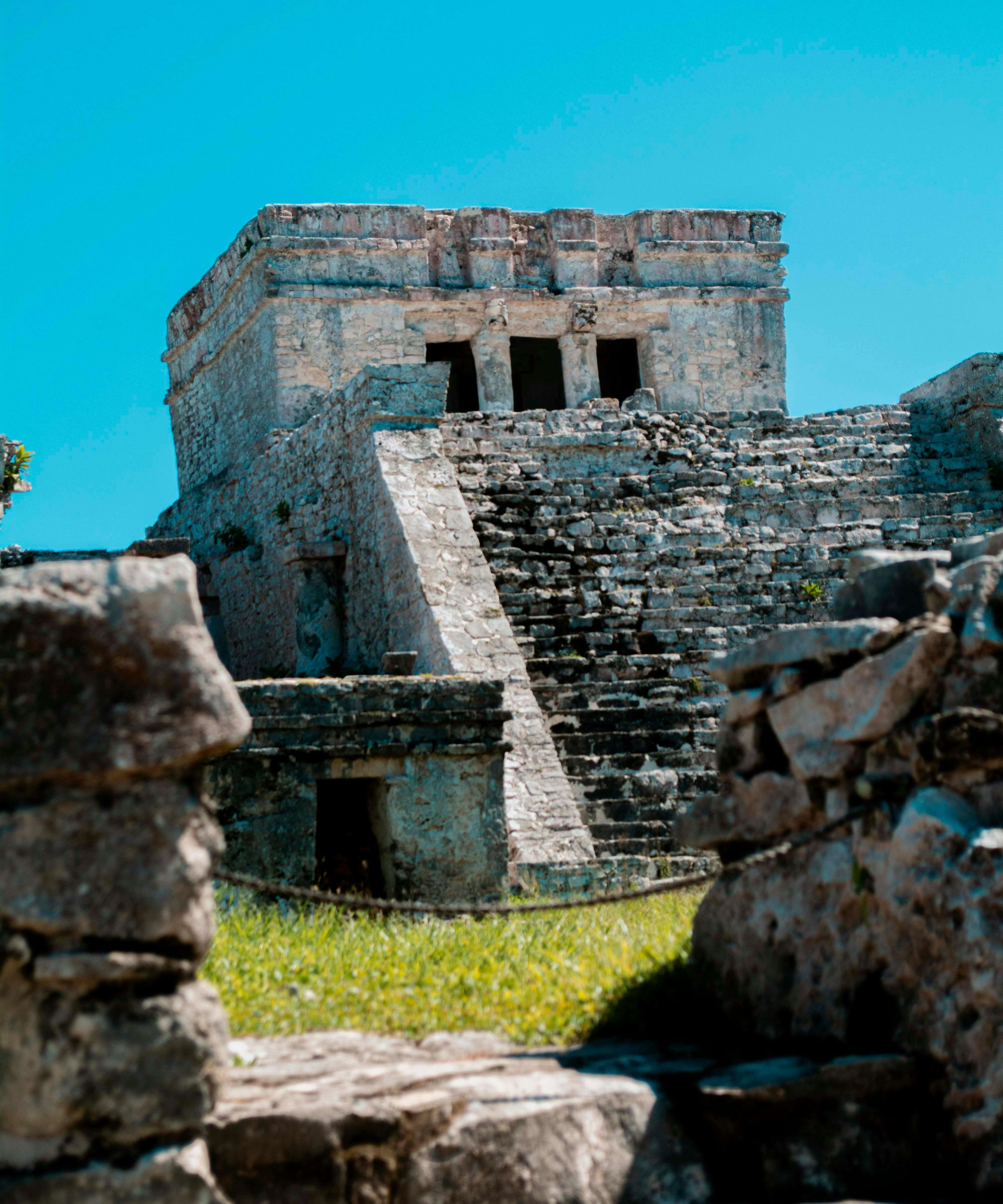 Explore ancient Mayan ruins with this vertical shot in Tulum, showcasing historic architecture.